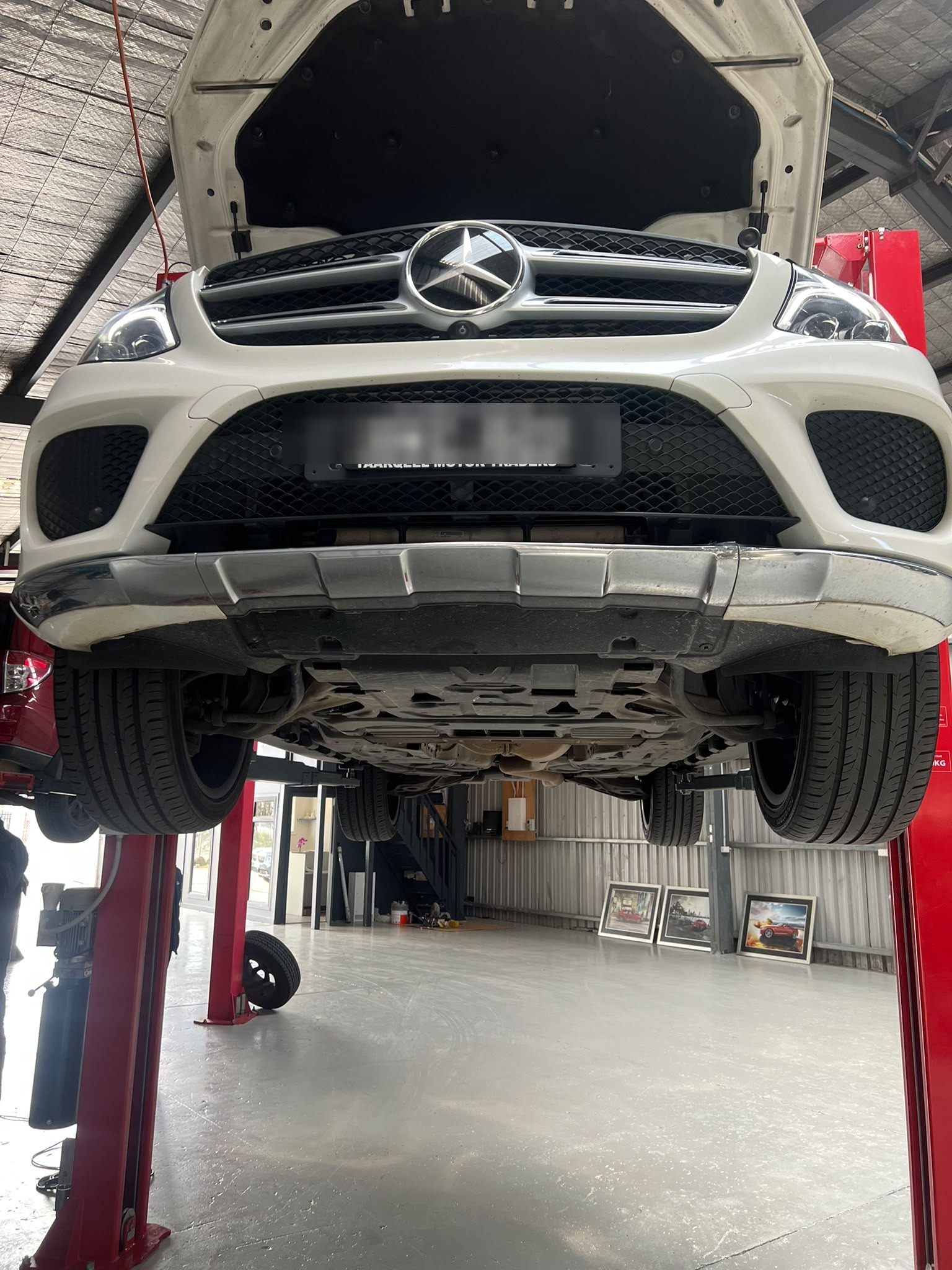 Mercedes-Benz on a hoist during a workshop inspection